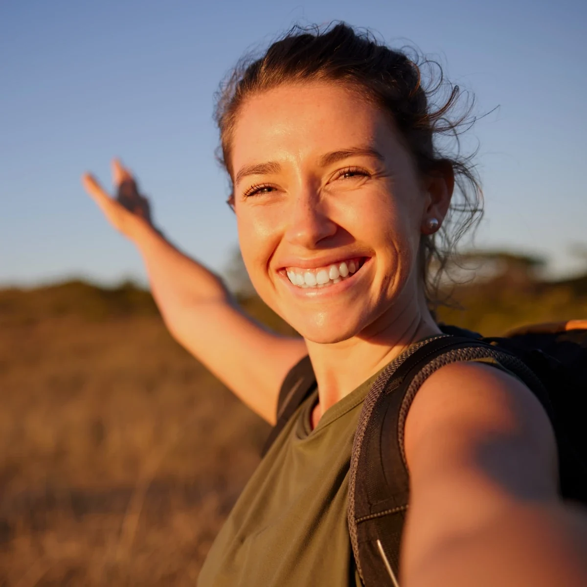 smiling young woman outdoors enjoying clear vision